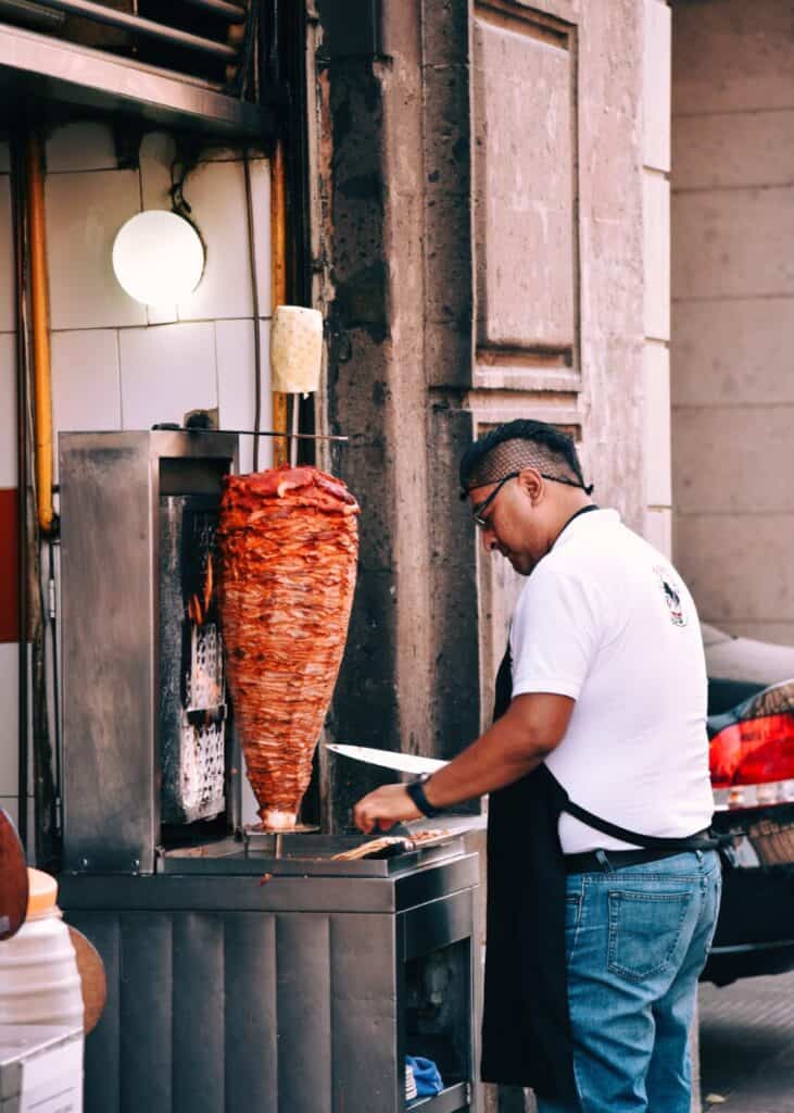 meat being sliced off kebab
