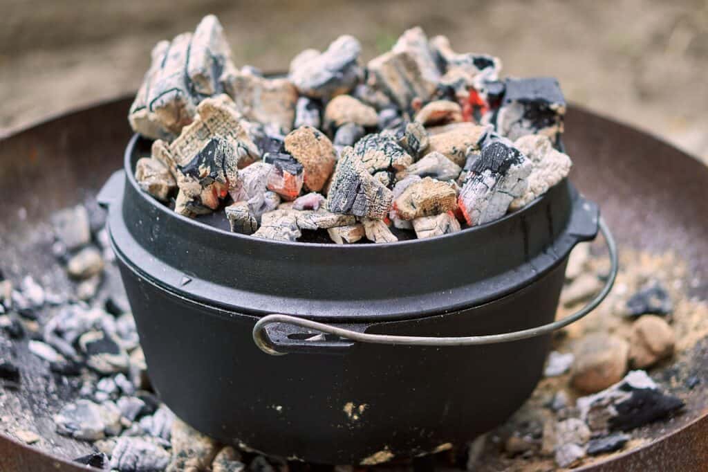 Dutch oven surrounded coals