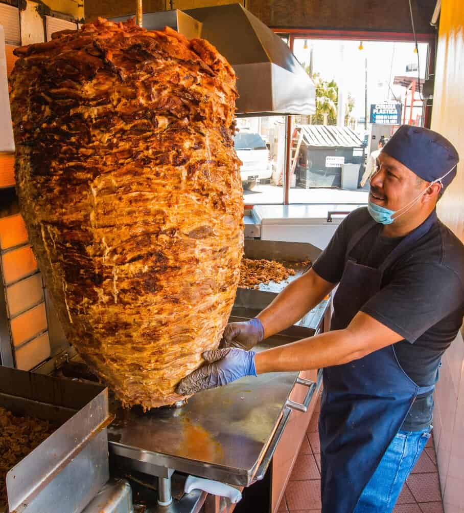 Worker carving kebab