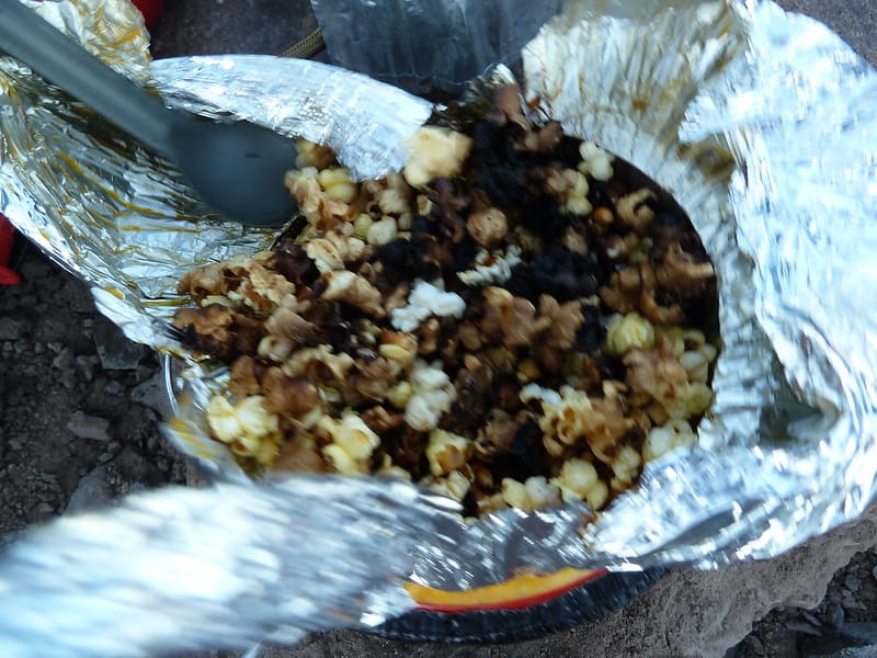 Cooking Jiffy Pop on the wood stove