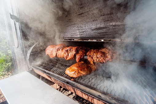 large barbecue smoker prepping meat