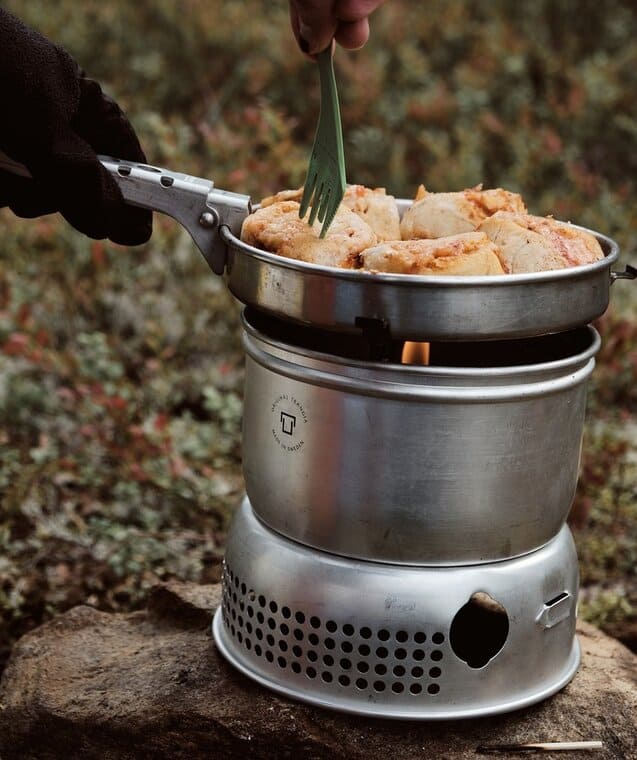 camp stove cooking chicken