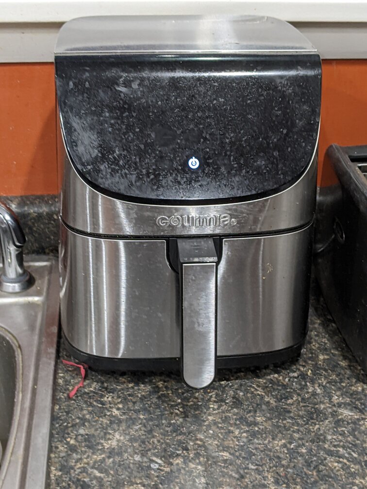 dirty air fryer on kitchen counter